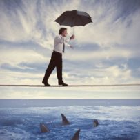 concept of insurance with businessman on the rope