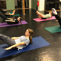 young ballet dancers doing Pilates - the hundred