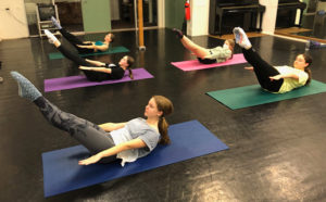 young ballet dancers doing Pilates - the hundred