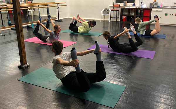 young ballet dancers doing Pilates - Rocking