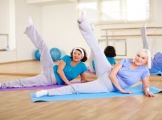 two elderly ladies doing Pilates